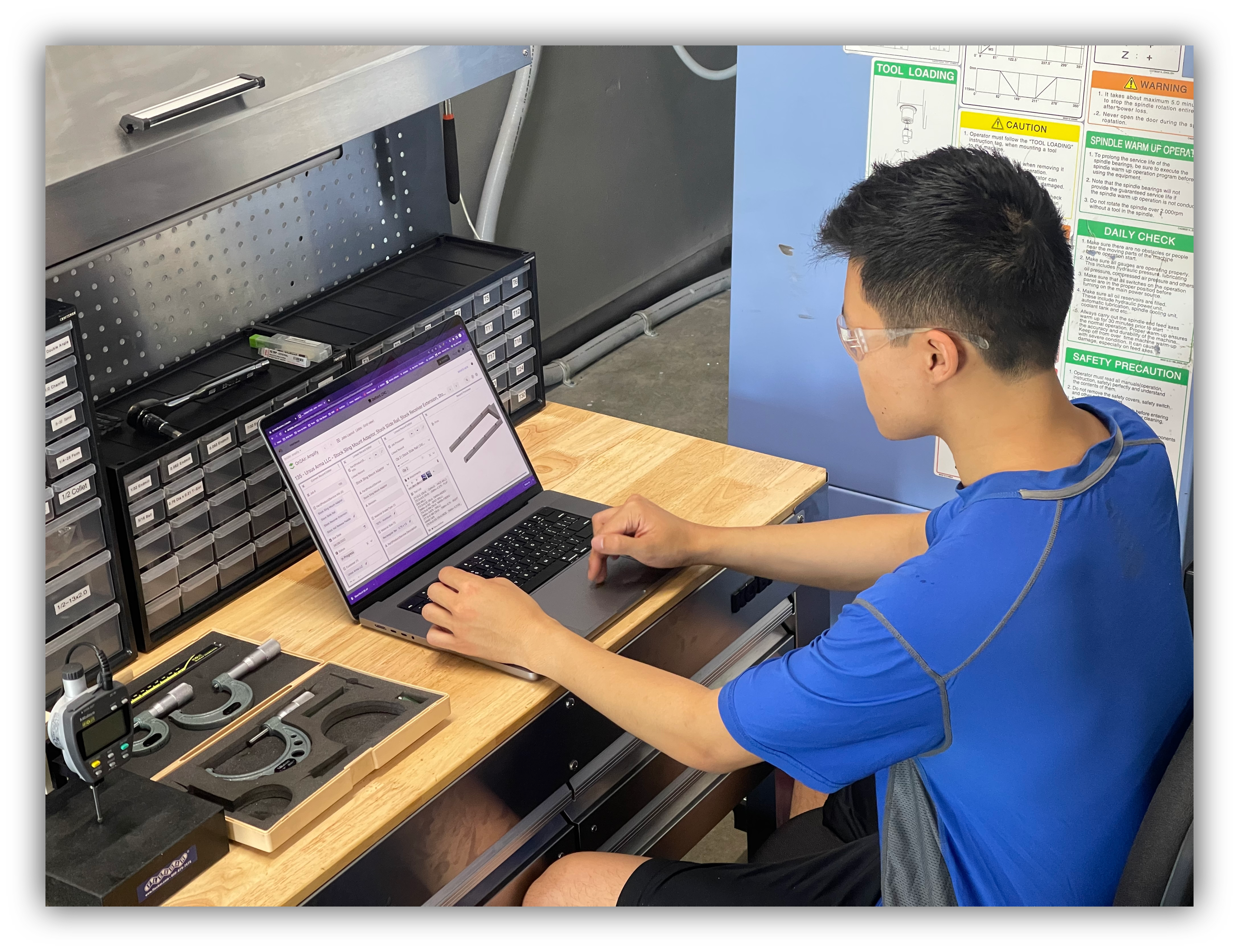 defiant cnc employee using the client portal